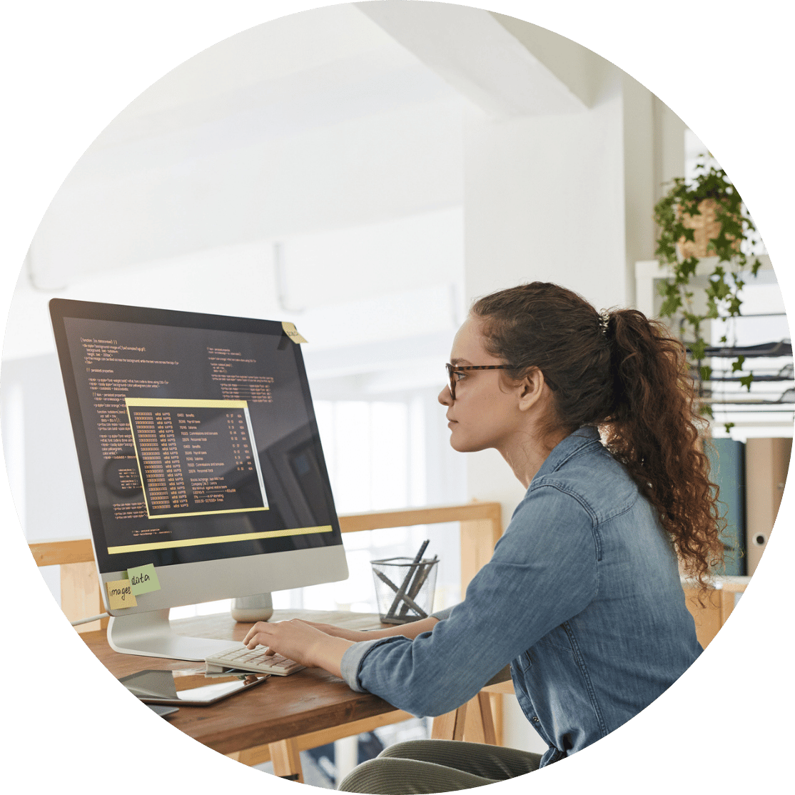 Woman coding at her desk