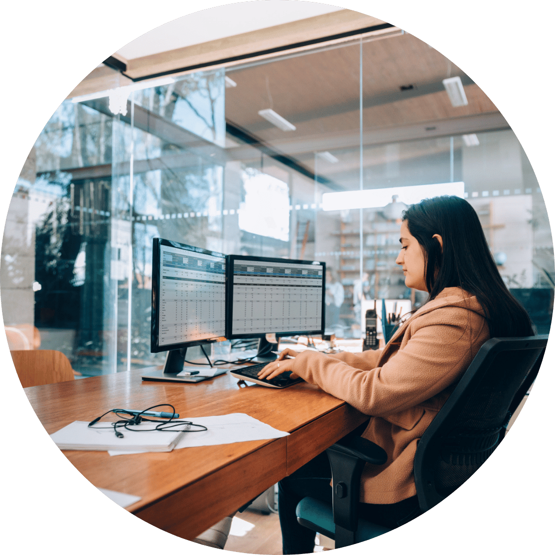 A woman working on a spreadsheet