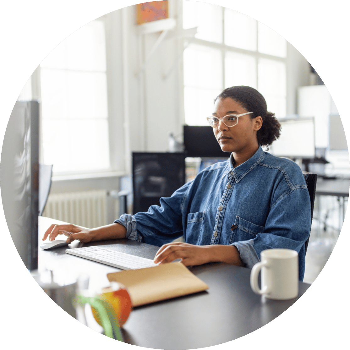 A woman concentrating on her desktop