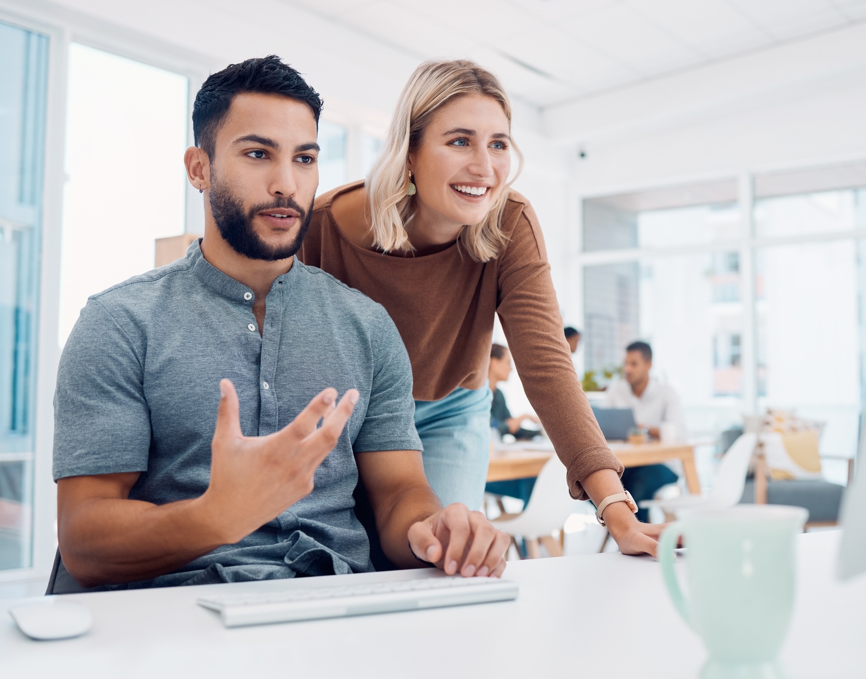 Two coworkers engaged in conversation