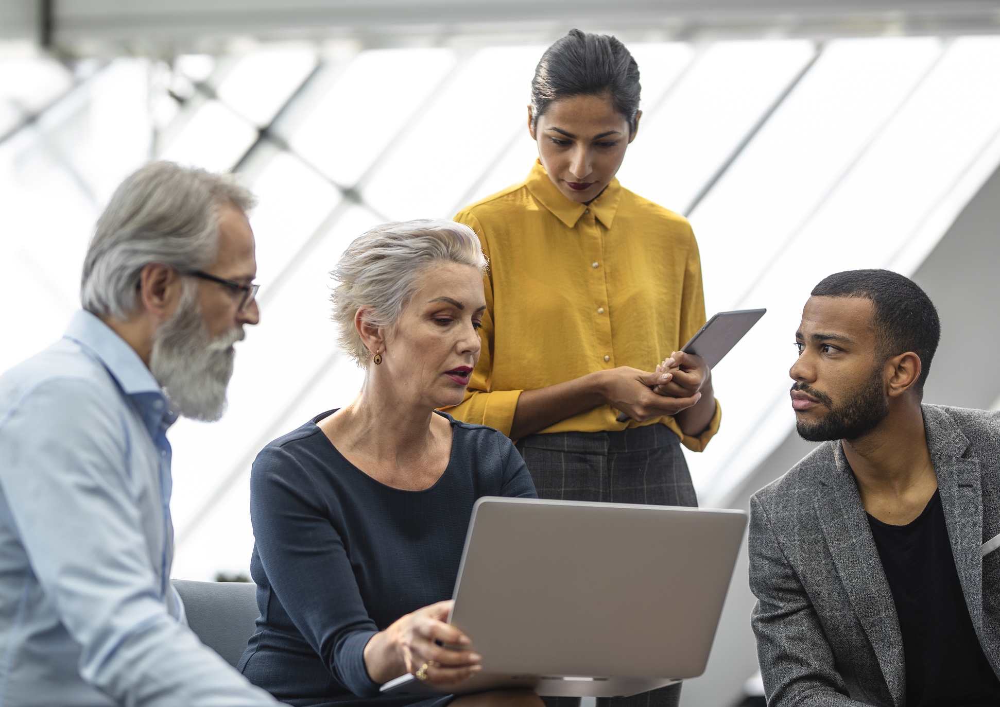 Four coworkers in a discussion