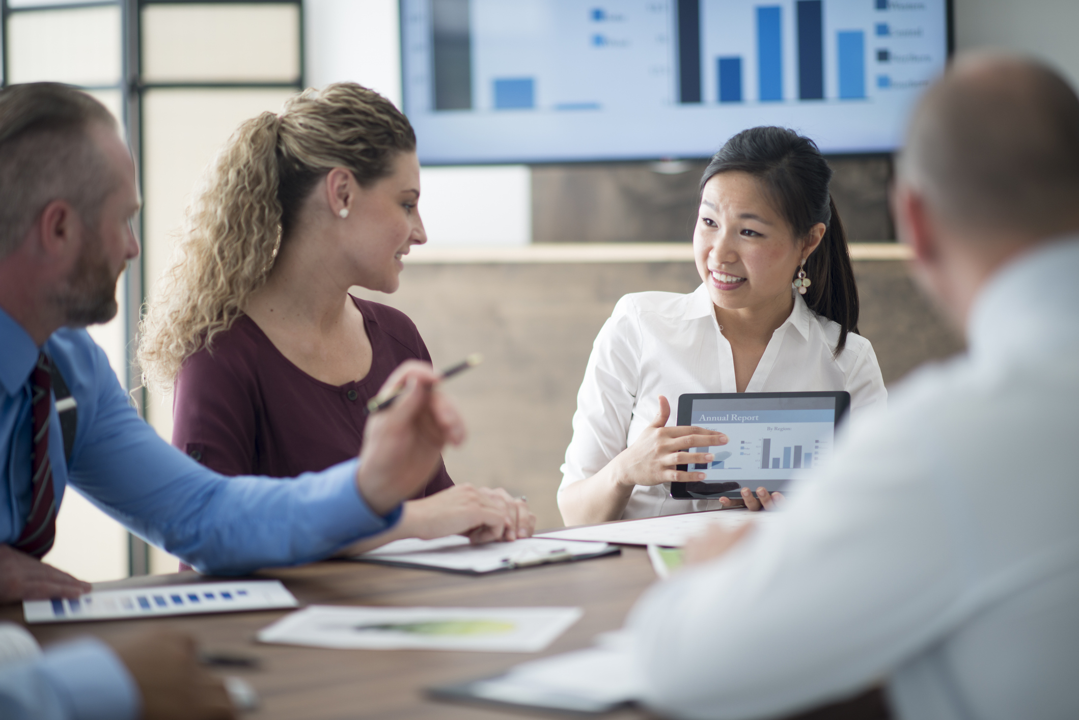 Four coworkers in an analytics meeting