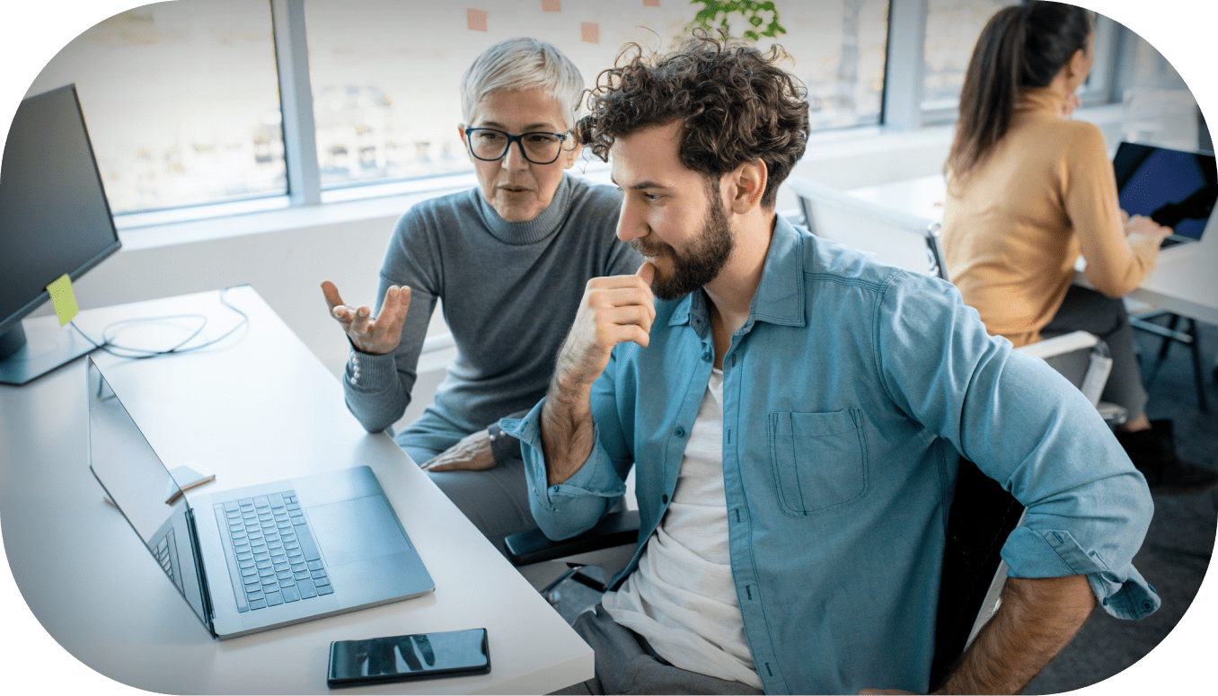 Two people working on a computer