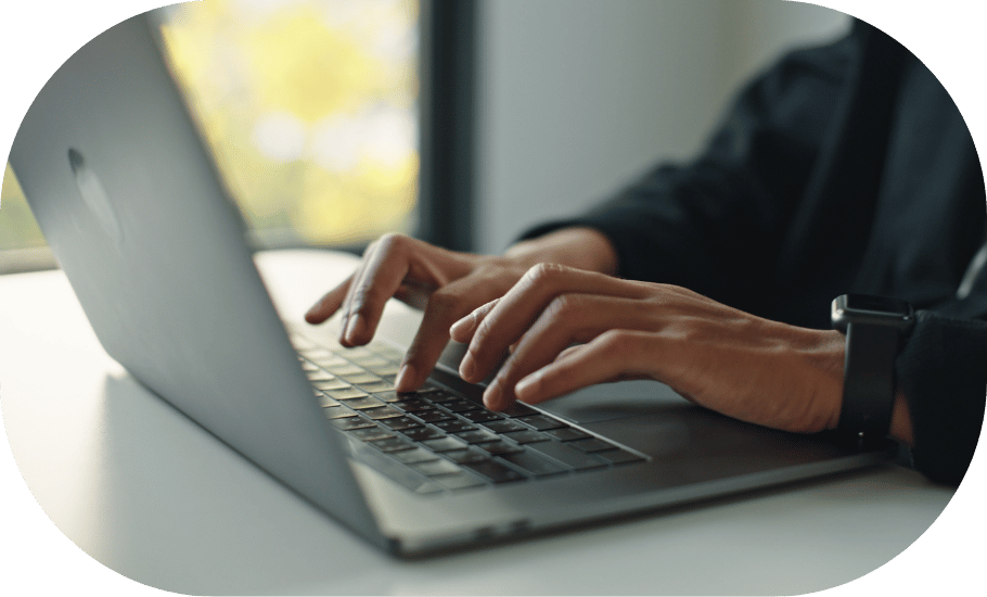 Person typing on laptop