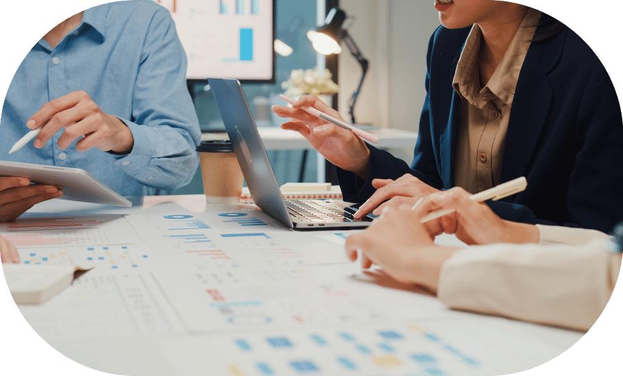 A meeting around a laptop and presentation