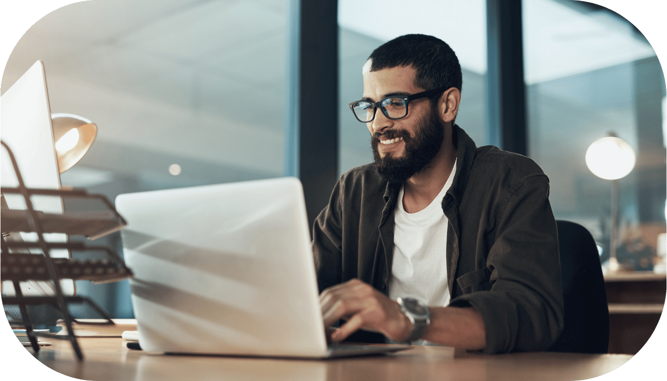 A man looking at a computer