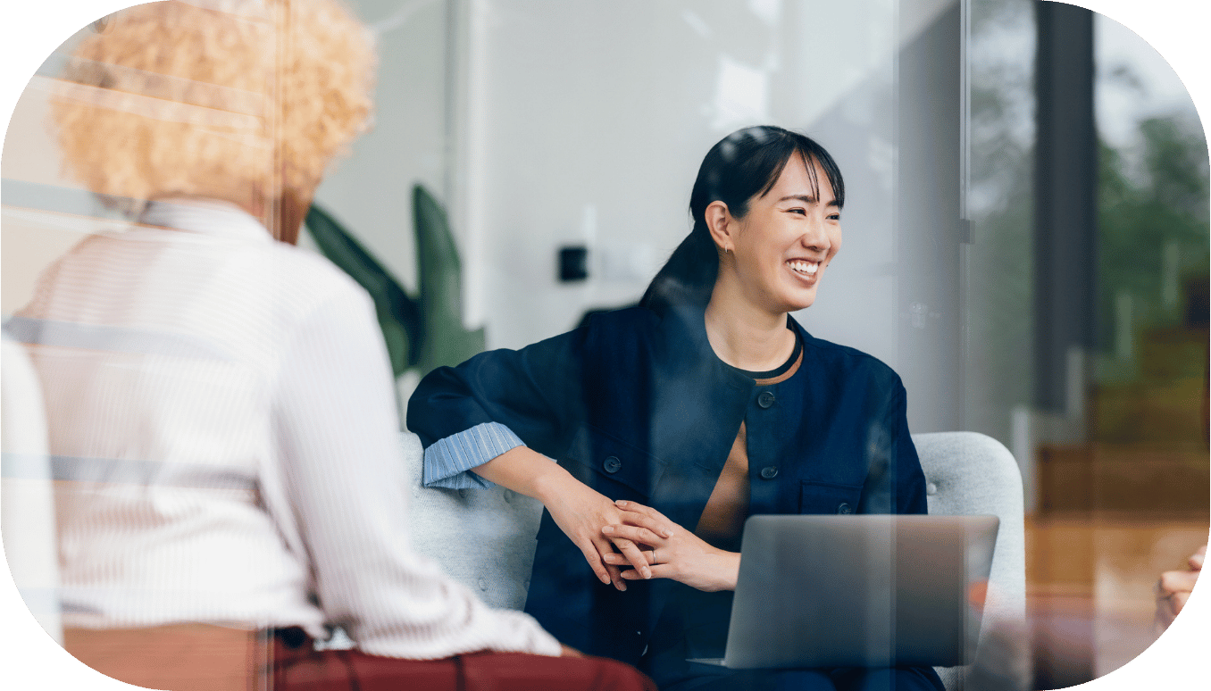 A woman smiling in a meeting