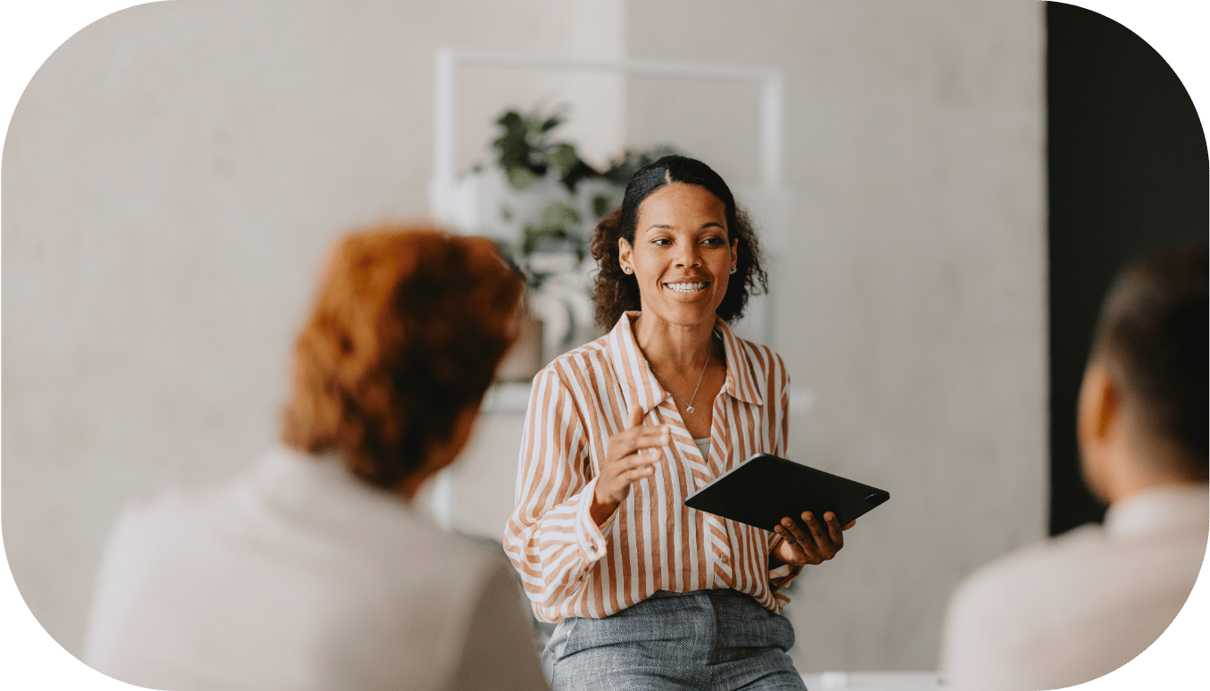 Woman talking to two coworkers