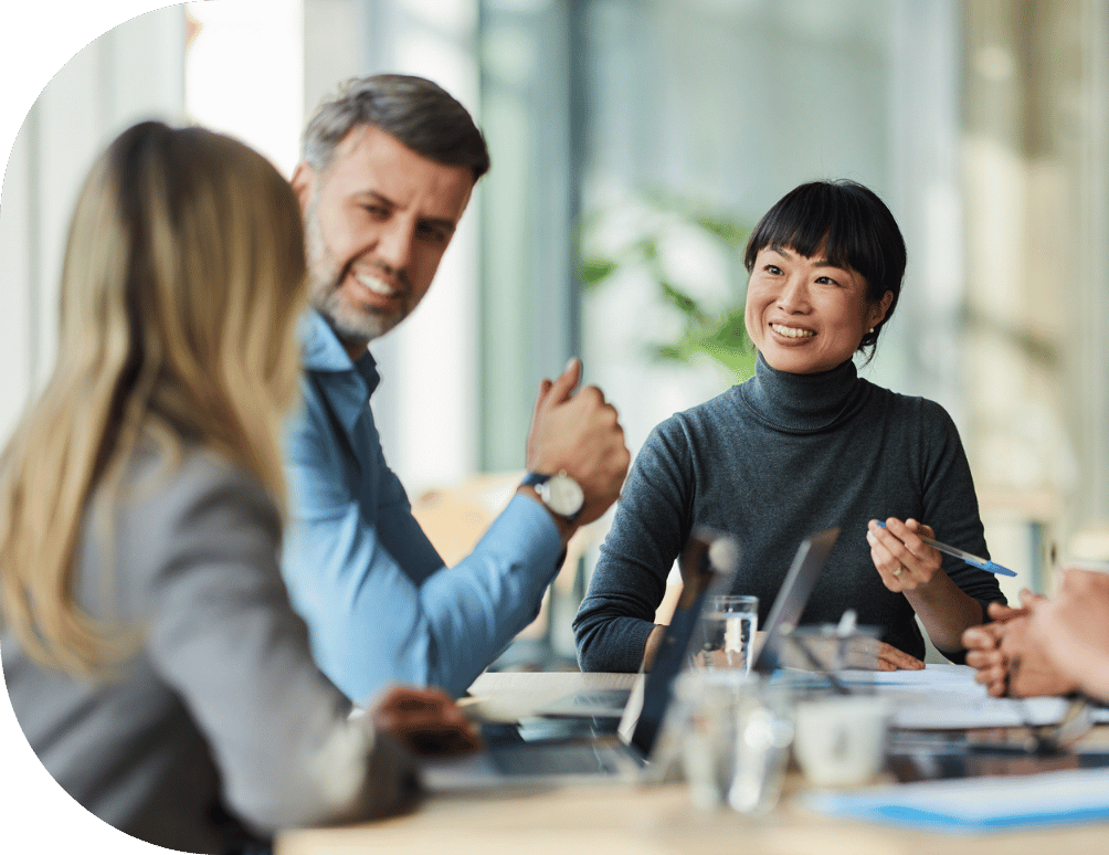 Three people chatting in a meeting