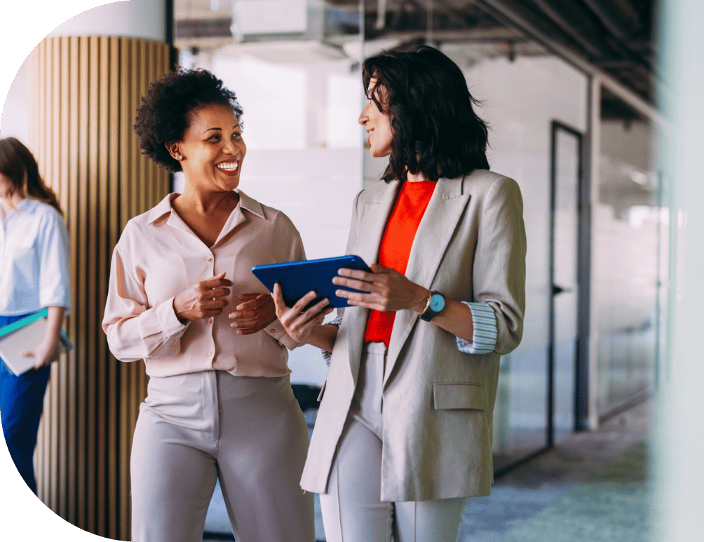 Two coworkers walking and talking