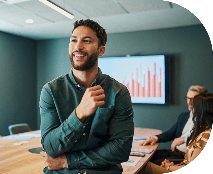 A man smiling in an office room