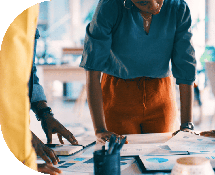 A woman reviewing printed documents