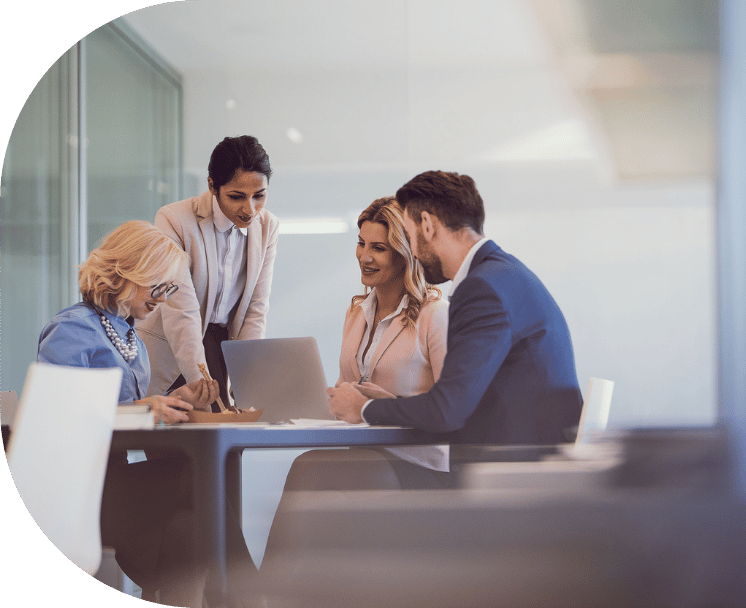 Team huddled around a laptop