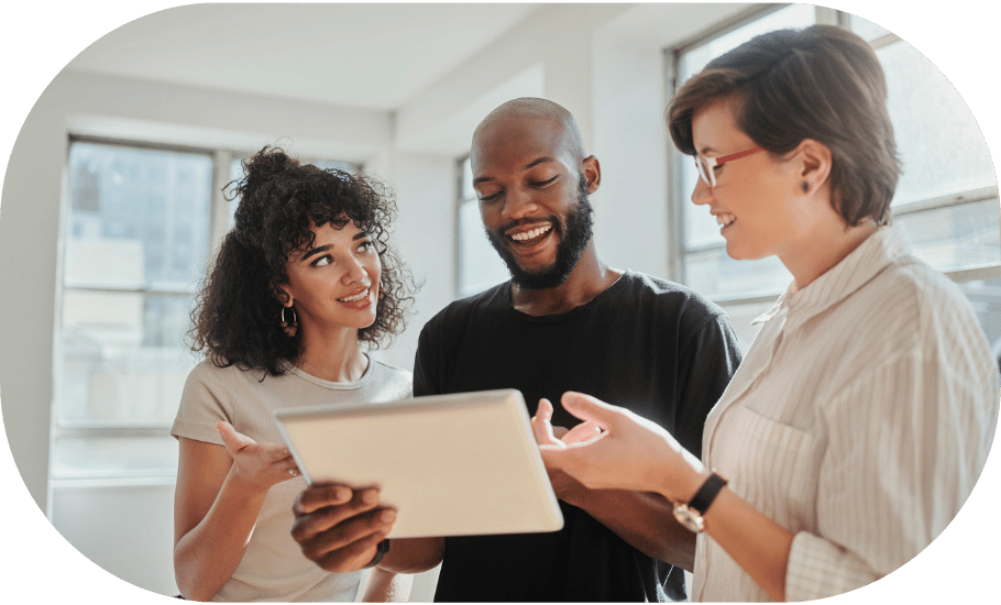 Three coworkers talking around a tablet